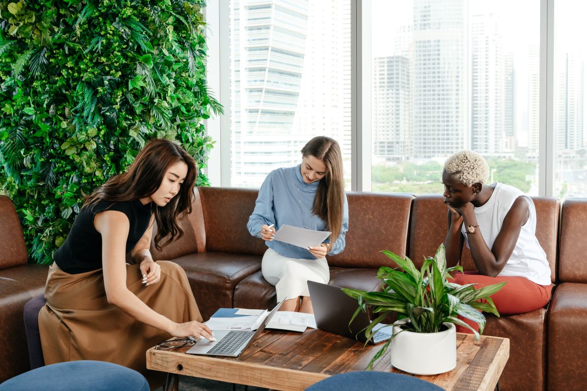 Business professionals discussing a project around a meeting table